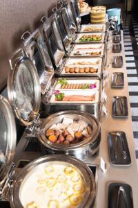 a buffet line with many different types of food at The Clouds Apartment in Shenzhen