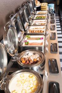 a buffet line with many different types of food at The Clouds Apartment in Shenzhen