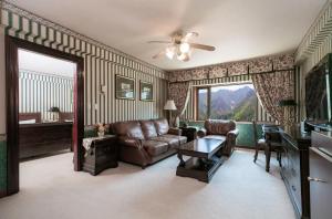 a living room with a couch and a table at KensingtonHotel Seorak in Sokcho