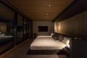 Postel nebo postele na pokoji v ubytování HOTEL CANATA KYOTO
