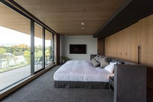 Postel nebo postele na pokoji v ubytování HOTEL CANATA KYOTO