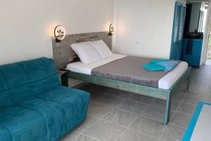 Postel nebo postele na pokoji v ubytování Rêve bleu au Diamant