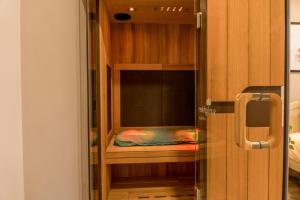 a room with a bed inside of a cabinet at The Honey Suite & Spa in Westminster