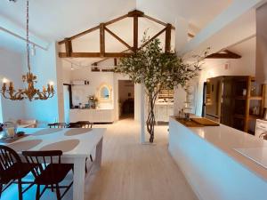 a kitchen and dining room with a table and chairs at Gonae Reborn in Jeju +180 photos