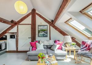 a living room with a couch and a table at The Loft in Rhayader