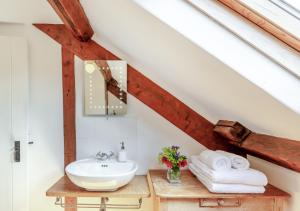 a bathroom with a sink in a attic at The Loft in Rhayader