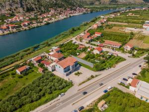 an aerial view of a house next to a river at Boutique rooms Kican in Metković