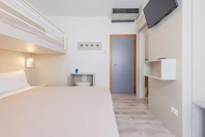 Postel nebo postele na pokoji v ubytování Hotel Madera