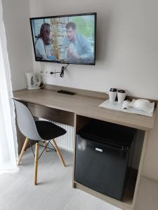 Televízia a/alebo spoločenská miestnosť v ubytovaní Family Homes - Sand House
