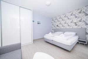 Postel nebo postele na pokoji v ubytování VacationClub - Livigno Apartament 7