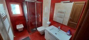 a bathroom with a toilet and a sink and a shower at Vile Park Apartments Pula in Pula +19 photos