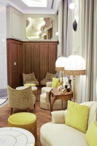 a living room with couches and chairs and a table at Orientbank Hotel Istanbul, Autograph Collection in Istanbul