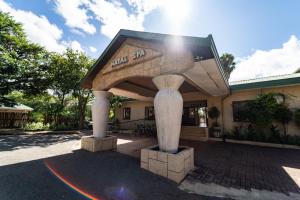 a building with a large building with avisor at Gooderson Natal Spa Hot Springs Resort in Paulpietersburg