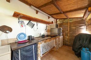 a kitchen with a sink and a counter top at Masseria li Vecchi in Squinzano