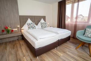 Postel nebo postele na pokoji v ubytování Hotel Volapük