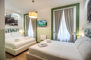 a living room with two beds and a couch at A Peace Of Rome in Rome