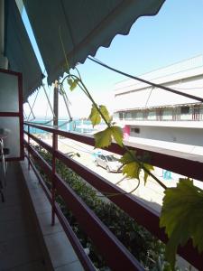 a view from the balcony of a building with a street at Diamanto Rooms in Eretria