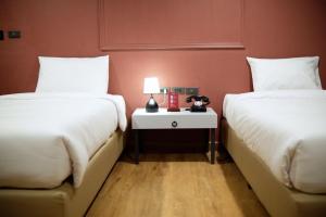 Postel nebo postele na pokoji v ubytování Lima Hotel