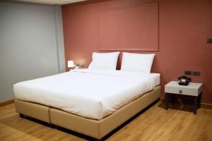 Postel nebo postele na pokoji v ubytování Lima Hotel