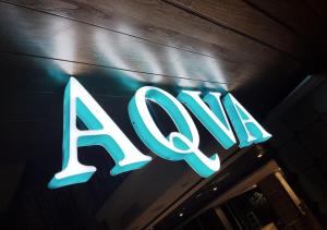 a neon sign on the front of a store at Astara Hotel Balikpapan in Balikpapan