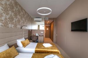 TV a/nebo společenská místnost v ubytování Grand SPA Lietuva Hotel Lietuva