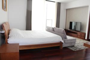 Giường trong phòng chung tại Davidduc's Apartment 5/41 Tay Ho
