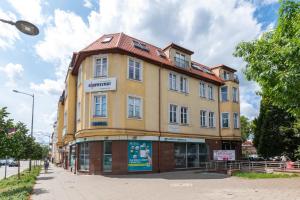 a large building on the corner of a street at Willa Bema in Olsztyn