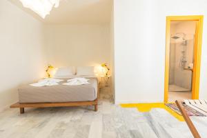 Postel nebo postele na pokoji v ubytování Mondrian Guest House