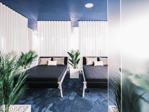 Voodi või voodid majutusasutuse Falkensteiner Hotel & Spa Jesolo toas