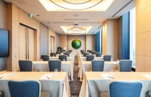 a row of tables and chairs in a room at Centara Grand Hotel Osaka in Osaka
