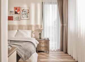 Postel nebo postele na pokoji v ubytování Davilla Đà Lạt Villa Collection