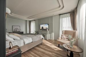Postel nebo postele na pokoji v ubytování Davilla Đà Lạt Villa Collection