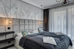Posteľ alebo postele v izbe v ubytovaní MALAGA APARTAMENTY BALTICUS