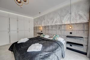 Posteľ alebo postele v izbe v ubytovaní MALAGA APARTAMENTY BALTICUS