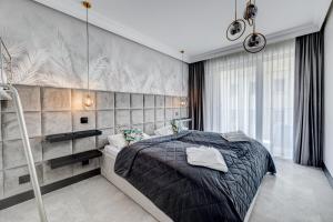 Posteľ alebo postele v izbe v ubytovaní MALAGA APARTAMENTY BALTICUS