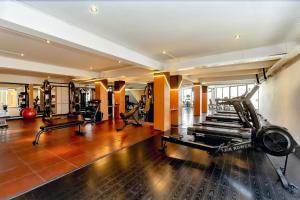 a gym with treadmills and exercise equipment in a room at Hotel Himalaya in Kathmandu