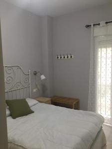 Ein Bett oder Betten in einem Zimmer der Unterkunft Apartamento La Caleta