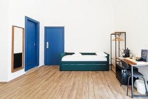 Säng eller sängar i ett rum på Palazzo Belmosto