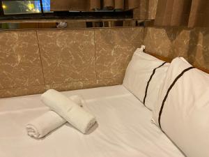 Postel nebo postele na pokoji v ubytování 安捷賓館 Famous Guest House