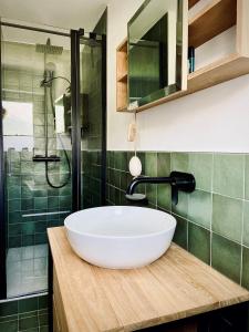 a bathroom with a large white sink and a shower at Appartment Alpenrose in Saas-Fee