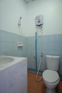 a bathroom with a toilet and a sink at Blue House Pai in Pai