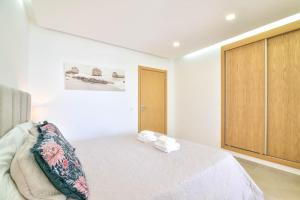 Łóżko lub łóżka w pokoju w obiekcie Casa Nico OceanView -Apartment 1901