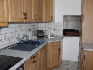 a kitchen with a sink and a counter top at Ferienwohnung Sonnenblume in Rhadern