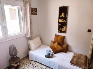 Ένα ή περισσότερα κρεβάτια σε δωμάτιο στο TILEMACHOS HOUSE