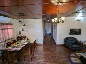 a dining room with a table and chairs at Mirabazar in Sylhet