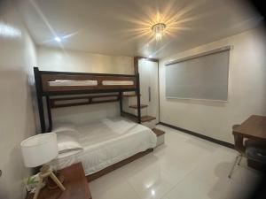 a bedroom with two bunk beds and a projection screen at 7th Heavens Vacation Home in Banaue