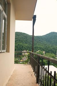 a balcony with a view of a mountain at Комната с видом на горы in Dilijan +7 photos