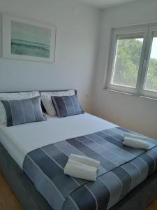 En eller flere senge i et værelse på Apartment Olea Crikvenica - with beautiful sea view, near the sandy beach and center