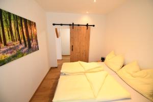 Voodi või voodid majutusasutuse Ferienapartments 31erHaus toas