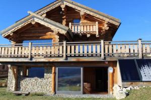 a log cabin with a balcony on top of it at Oxygene in Font-Romeu-Odeillo-Via